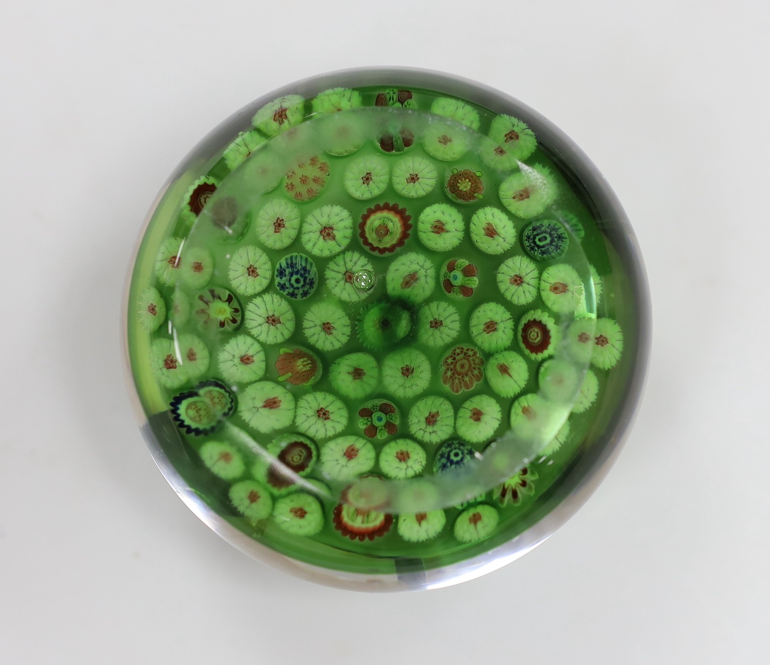 A 19th century French glass millefleur spaced cane paperweight, 8.5cms diameter